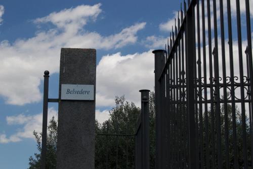 a sign on a gate next to a fence at Villa Belvedere in Militello in Val di Catania
