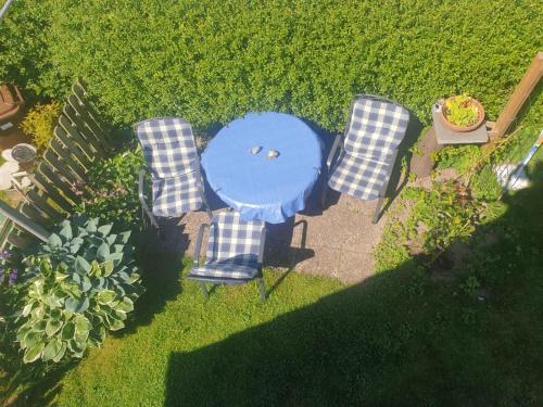 an overhead view of a table and two chairs at Ruegen_Fewo 41 in Rambin