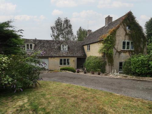 an old house with a driveway in front of it at St Mary's House in Chipping Norton