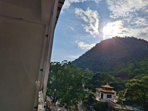 a view of a mountain from a window of a building at Meerut Sky view in Maheshwar