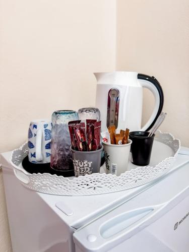 a shelf on the top of a white refrigerator at Avli Studios in Nydri