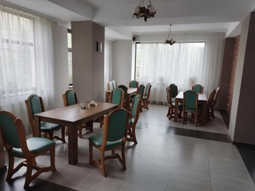 a dining room with a table and chairs at Cabana Bella Vista in Ranca