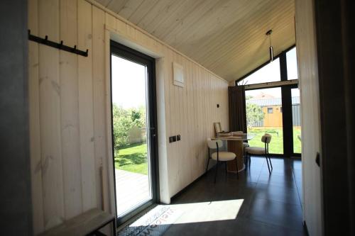 a room with a large glass door and a table at Ministerka House in Kyiv