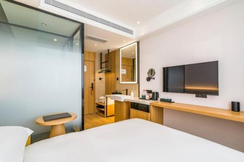 TV/Unterhaltungsangebot in der Unterkunft VYLUK Hotel Beijing Universal Studios-蔚徕酒店 北京环球影城店