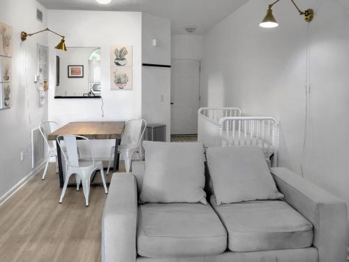 a living room with a couch and a table at Garden Level 1BR condo, Central Luxury Suite in Wilmington