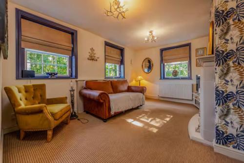 a living room with a couch and a chair at William Oakes Georgian Garden House - Bridgnorth Pass the Keys in Bridgnorth