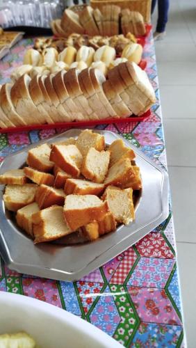 a plate of food on a table with bread at Villa Mar Boa Viagem in Recife