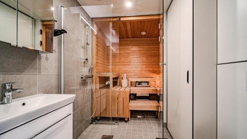 a small bathroom with a sink and a counter at Ylläs Chalets 4101 in Ylläsjärvi