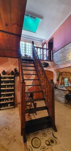 a wooden staircase in a room with wine racks at شاطئ مونيكا in Mohammedia