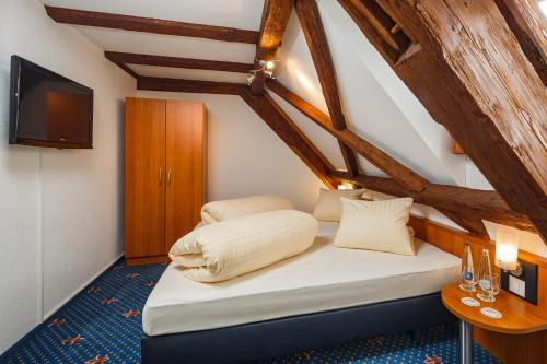 Postel nebo postele na pokoji v ubytování Seemöwe Swiss Quality Hotel