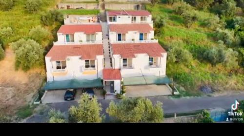 a large white house with a red roof at Donald Hotel in Vlorë