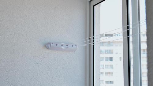 a remote control on the side of a window at Apartment SOFI Belville in Novi Beograd
