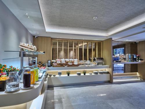 a kitchen with a counter with food on it at Four-G Hotel Premium in Istanbul
