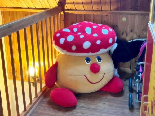 a stuffed animal with a hat sitting on the floor at Ferienwohnung Teschow in Teschow