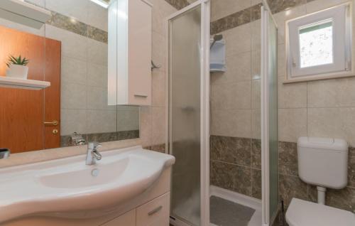 a bathroom with a sink and a shower at Villa Sestic-Makarska by Villas Guide in Tučepi