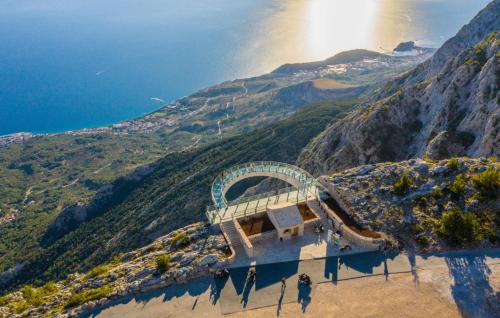 a view of a mountain with the sun shining on it at Villa Sestic-Makarska by Villas Guide in Tučepi