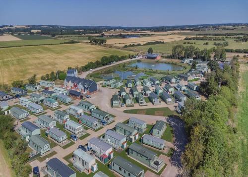 an aerial view of a housing estate at Herons Mead Cottages in Orby