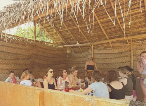 a group of people sitting at a table at Maika safari lodge in Udawalawe