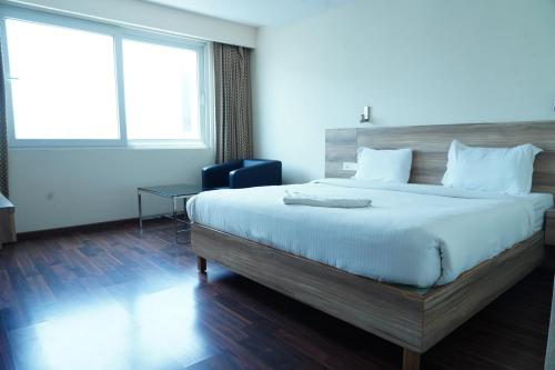 Ein Bett oder Betten in einem Zimmer der Unterkunft Hotel RN Grand