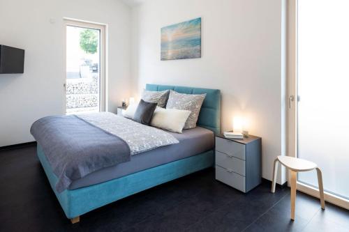 Ένα ή περισσότερα κρεβάτια σε δωμάτιο στο Ferienhaus Altstadtblick
