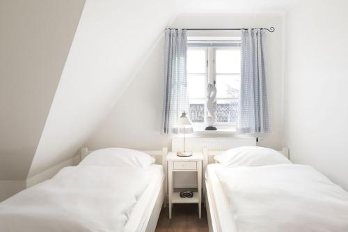 Postel nebo postele na pokoji v ubytování Haus Amrumblick