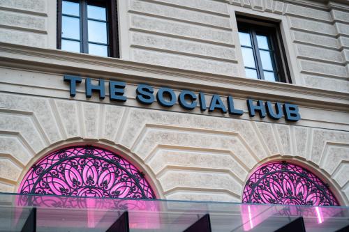 a building with the social hub sign on it at The Social Hub Florence Lavagnini in Florence