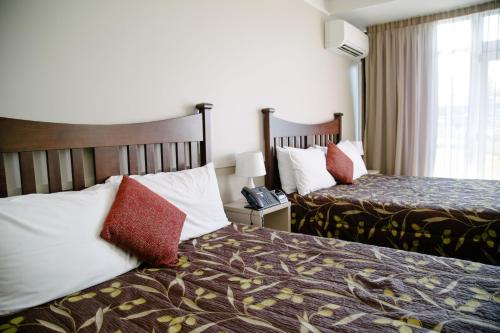 Postel nebo postele na pokoji v ubytování Hotel Ashburton