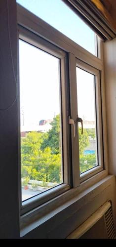 a window with a view of a yard at Hotel Gurveer Royal in Lucknow