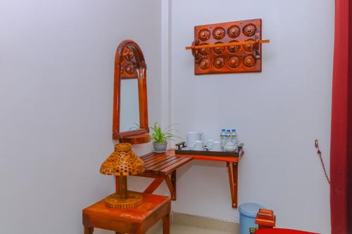 a room with a dressing table and a mirror at Castle Resort Yala in Tissamaharama