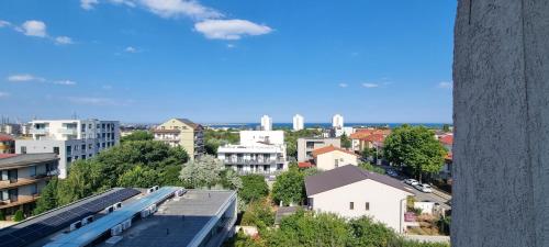 a view of a city with buildings and a train at Hotel Blue Sky Resort in Eforie Nord