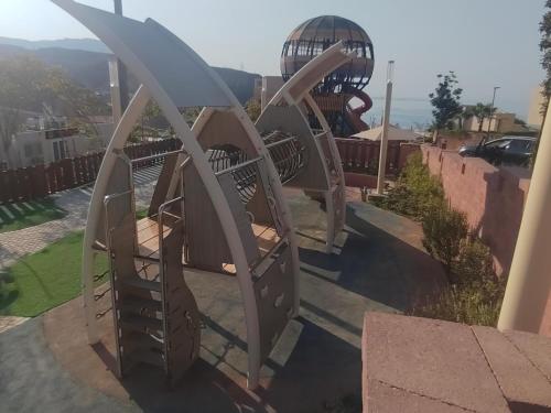 a set of three slides in a playground at IL MONTE Galala -families only- المونت جلالة in Ain Sokhna