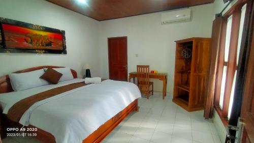 Ένα ή περισσότερα κρεβάτια σε δωμάτιο στο Serongga guest house