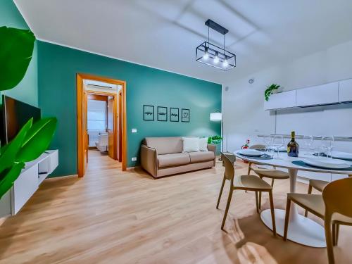 a living room with a couch and a table at Suite Deluxe Apartment Wellness Abano Terme in Abano Terme