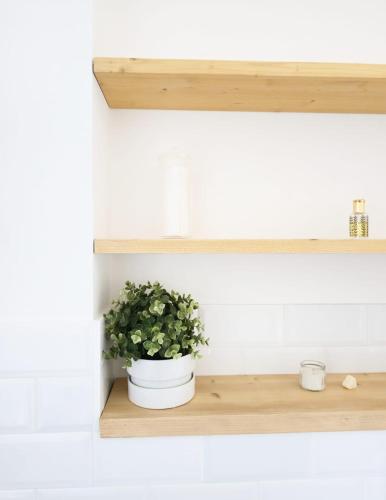 a potted plant sitting on a shelf in a kitchen at Sicily Sea Home in Aci Castello
