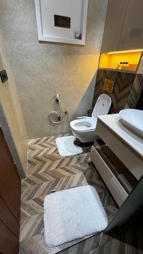 a bathroom with a toilet and a sink at Casa Royale An Escape with Elegance in Amritsar
