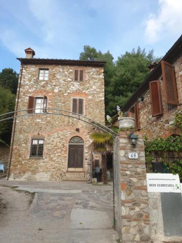 an old stone building with a door in front of it at Vacation Home Tuscany Pisa-Lucca 1 in Filettole