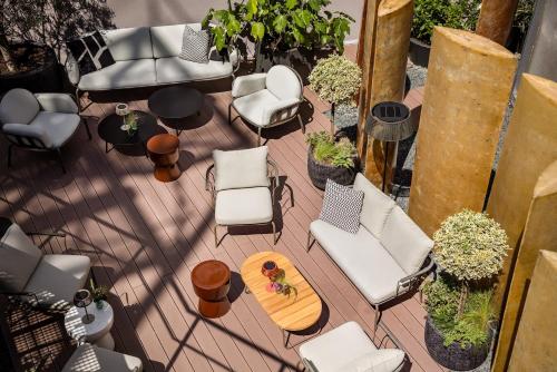 an overhead view of a patio with chairs and tables at Hotel AMANO Düsseldorf in Düsseldorf