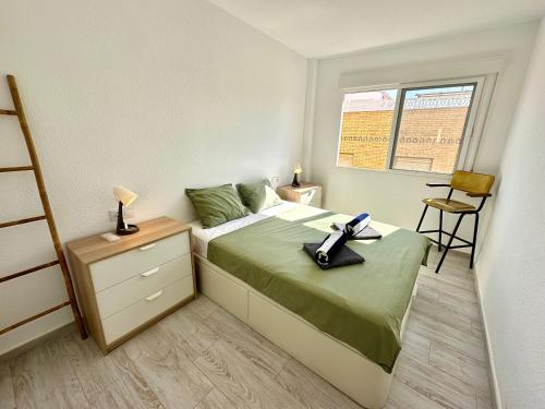 En eller flere senge i et værelse på Apartamento Pinta