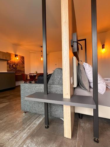 a mirror in a living room with a couch at Maso Valèr - Agritur in Tassullo