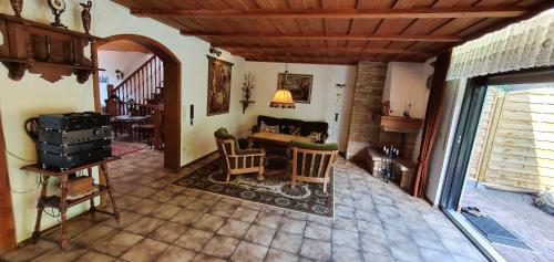 a living room with a couch and a table at Ferienhaus Korn mitten im schönen Pfälzer Wald, Privat Haus in Bruchweiler-Bärenbach