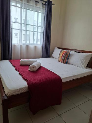 Un ou plusieurs lits dans un hébergement de l'établissement Modern 3-Bedroom Apartment with Gym, Pool and Basketball Court in Buxton Point, Mombasa