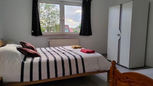 Postel nebo postele na pokoji v ubytování Appartement les mirabelles entre Strasbourg et Haguenau
