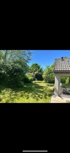 a picture of a gazebo in a field of grass at La cabane du Cerf in Stavelot