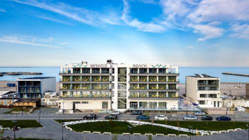 a rendering of a hotel with the ocean in the background at Mirage Beach Spa Hotel in Eforie Nord