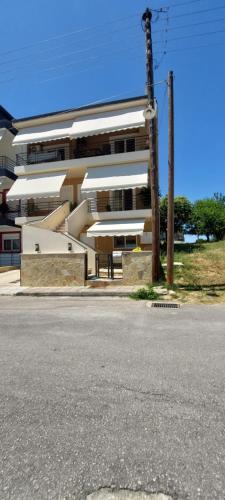 an empty street in front of a building at Family House Dim in Ioannina