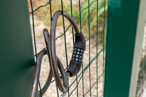a fence with a phone attached to it at BBConegliano Bixio in Conegliano