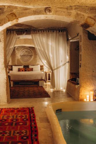 Cama o camas de una habitación en Doda Artisanal Cave Hotel 14 Plus