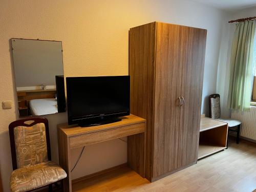 a room with a television on a wooden cabinet at Wiedemann Heiko in Mellenthin