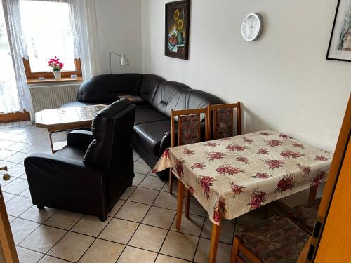 a living room with a couch and a table at Wiedemann Heiko in Mellenthin