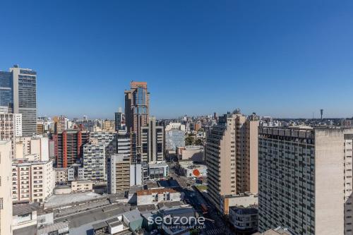 a view of a city with tall buildings at Estúdio Completo em Curitiba EDA0001 in Curitiba